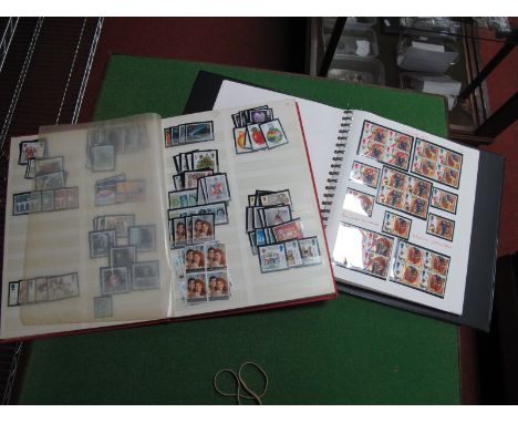 A Collection of G.B. Mint Stamps, in a 22 ring album and stockbook, with a face value of over £60.