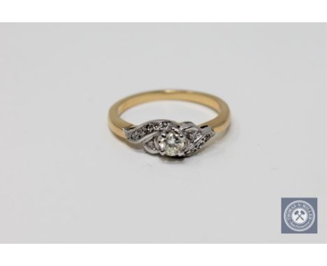 An 18ct gold diamond set ring, size M