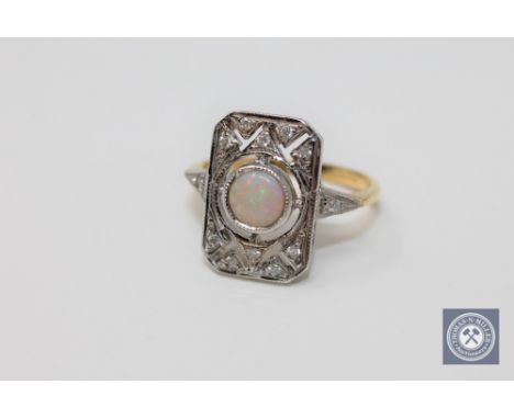 An 18ct gold opal and diamond ring, size O