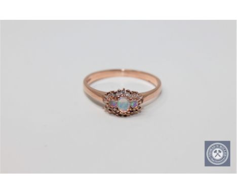 A 9ct gold opal and diamond ring, size P