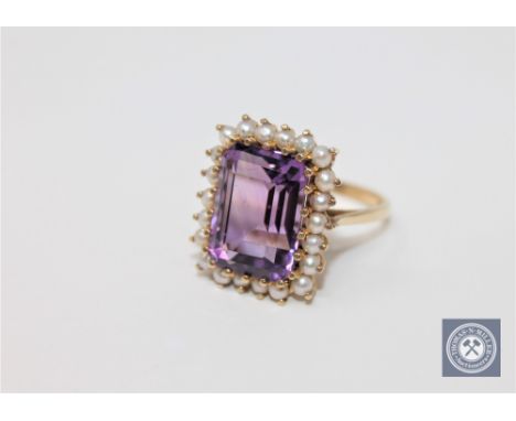 A 9ct gold amethyst and pearl ring, size O