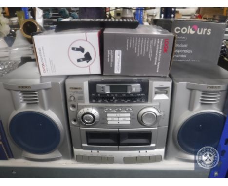 An LCD TV together with an Aiwa hifi system, two telephone sets and pendant ceiling light 