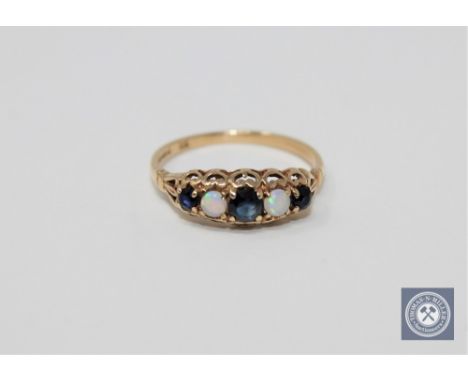 A 9ct gold sapphire and opal set ring, size I 1/2.