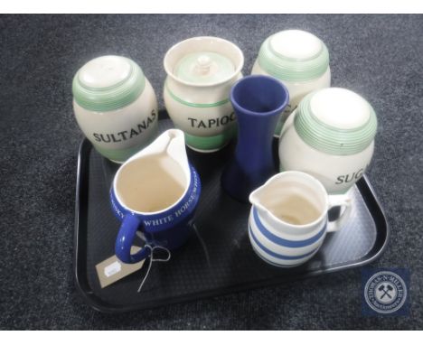 A tray of Wade White Horse Scotch Whisky jug, Cornish ware jug together with Denby pottery vase, four mid 20th century potter