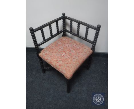 An early 20th century bobbin corner chair