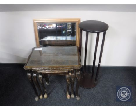 A nest of three figured walnut glass topped tables together with a plant stand and a gilt framed mirror