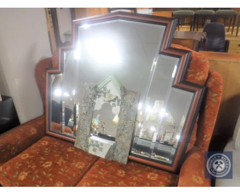 An ornate mirror together with a mahogany framed bevelled fan mirror 