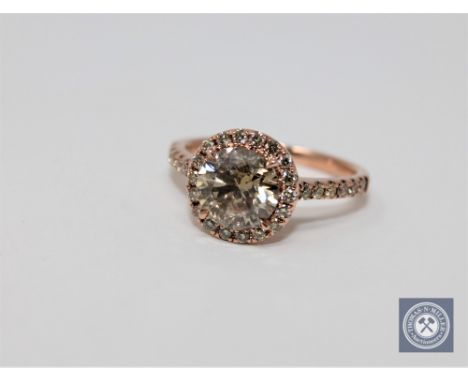 A 14ct rose gold diamond ring featuring center one round brilliant cut diamond 1.75ct with 36 round brilliant cut diamonds 0.