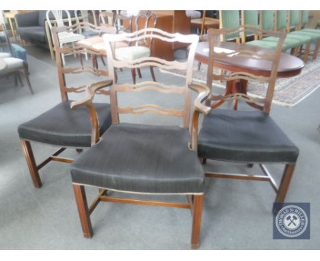 A set of eleven mahogany ladder back dining chairs comprising of one carver and ten singles