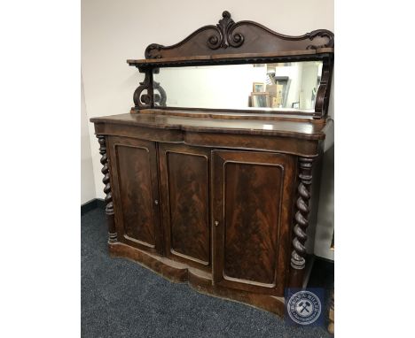 A Victorian mahogany serpentine fronted mirror backed chiffonier 