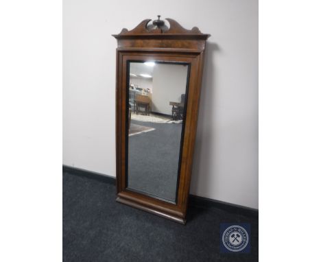 An antique mahogany hall mirror
