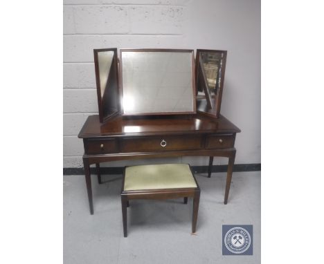 A Stag Minstrel dressing table with triple mirror and stool