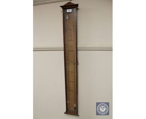 A continental mahogany stick barometer