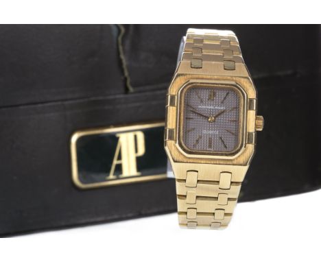 LADY'S AUDEMARS PIGUET WRIST WATCH, 1980 from papers, the rounded rectangular dark grey textured dial with applied gold baton