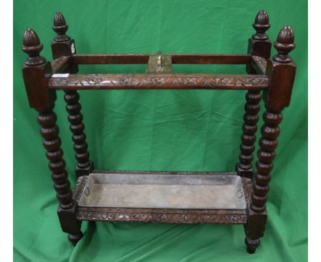 Carved oak stick stand with bobbin turned legs 