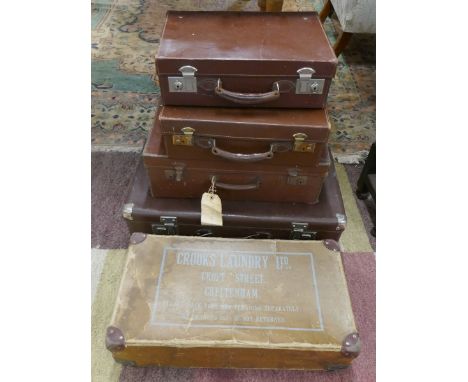 4 vintage suitcases and a vintage laundry box 