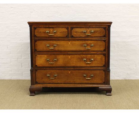 A George III Oak and Mahogany Cross-Banded Chest A George III Oak and Mahogany Cross-Banded Chest, the moulded top above an a