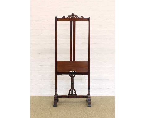 A Late Victorian Mahogany Easel A Late Victorian Mahogany Easel, with pierced pediment and adjustable platform, the lower sec