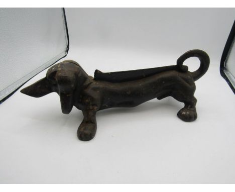 Cast iron sausage dog door stop