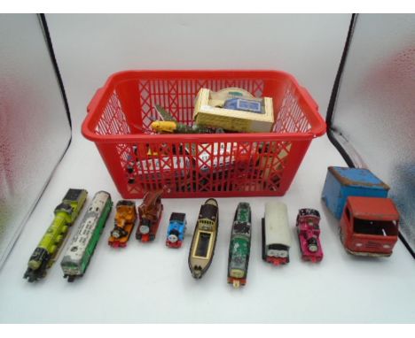 Basket of model cars, wooden train, aeroplanes, etc.. to include Thomas the Tank engine models some by Ertl.  