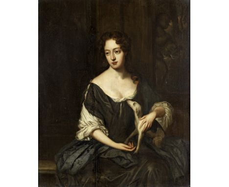 Follower of Constantyn Netscher (The Hague 1668-1723)Portrait of a lady, three-quarter-length, in blue with a dogoil on panel