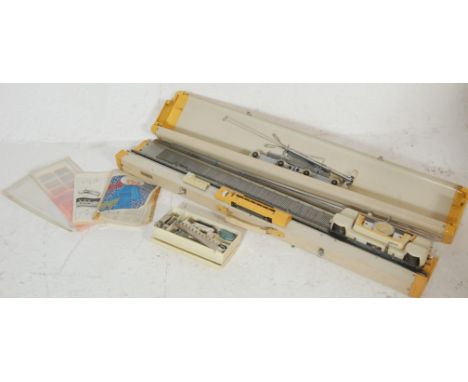 A vintage Empisal Knitmaster model 321 knitting computer machine in original cream case with instructions.