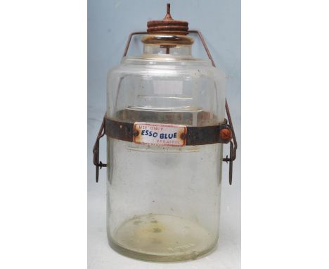 A vintage mid 20th century Esso Blue paraffin glass dispenser in cylindrical form with wired swing handle attached by a metal