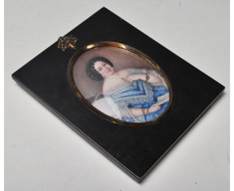 A 19th Century Victorian portrait miniature painting on ivory depicting a female figure with a blue and lace dress with highl