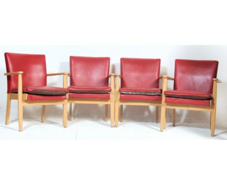 A set of four vintage retro mid 20th century Parker Knoll blondewood / beechwood lounge armchairs having flat armrest, red le