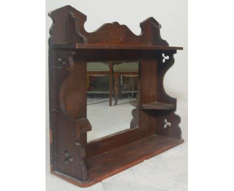 A late 19th century Victorian Arts &amp; Crafts oak wall - overmantel mirror. Plinth shelf base with column sides having cent