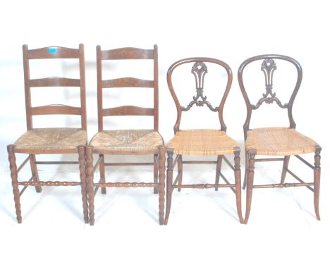 A pair of Victorian 19th century mahogany and rush seated bedroom chairs having splat back and rush sheets raised on carved s
