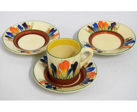 A Clarice Cliff Bizarre Crocus coffee cup &amp; saucer twined with two other saucers