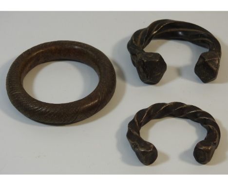 Three 19thC. African bronze slave manillas, largest 3.25in diameter