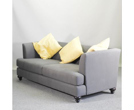 A modern grey upholstered sofa, 205cm, together with three cushions