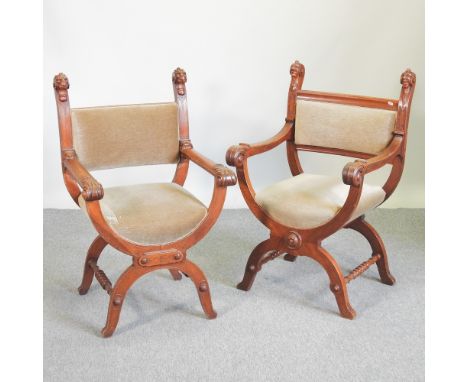 A near pair of 19th century continental carved light oak throne chairs, on x frame bases, with lion's mask terminals
