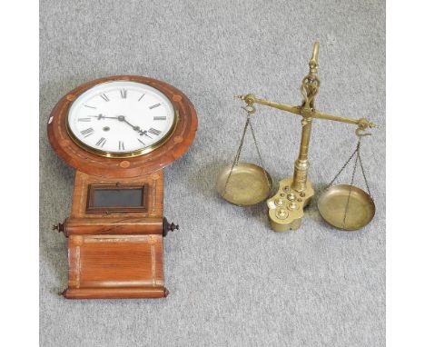 A 19th century walnut and inlaid drop dial wall clock, 73cm high, together with a set of brass scales and weights