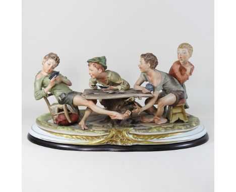 A large Capodimonte figure group of boys playing cards, 55cm