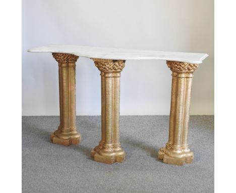 A gilt painted console table with a shaped marble top, 152cm