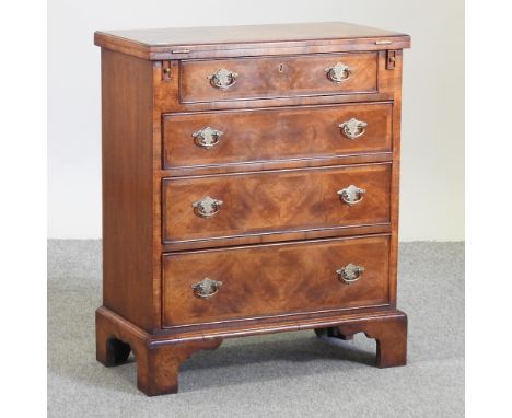 A bespoke made walnut bachelor's chest, on bracket feet, 63cm