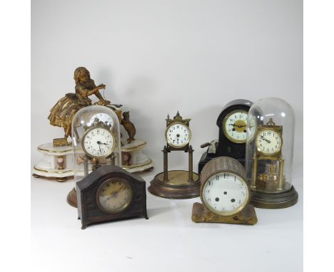 A figural mantel clock, 35cm high, together with a black slate mantel clock, two anniversary clocks under domes and other clo