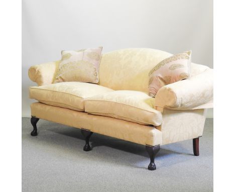 A Wesley Barrell Marlborough three seater sofa, with rose gold damask upholstery, on claw and ball feet, 207cm, with loose cu