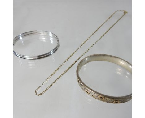 An Italian 18 carat white gold bangle, 10g, together with a 9 carat gold chain, 4g and a silver  hinged bangle
