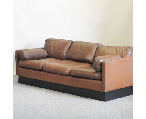 A 1960's Danish style brown leather upholstered sofa, 210cm