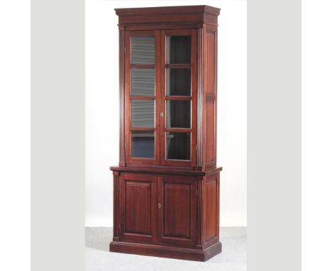 A stained teak cabinet bookcase, 95cm