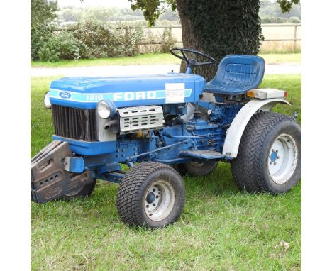 A barn find blue 1980's Ford 1210 compact tractor