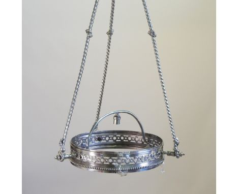 A chrome circular pierced metal chandelier, 45cm diameter
