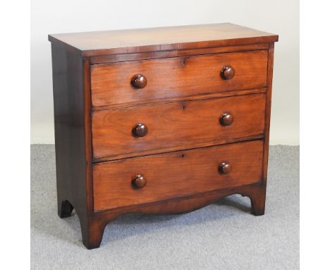 A Victorian flame mahogany chest, containing three graduated drawers, on bracket feet, 94cm