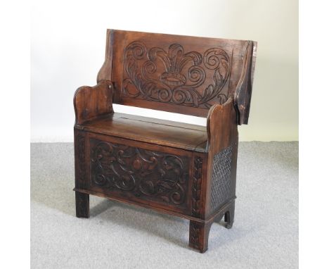 A 19th century carved oak monk's bench, 91cm