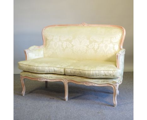 A French style pale yellow upholstered show frame sofa, 136cm