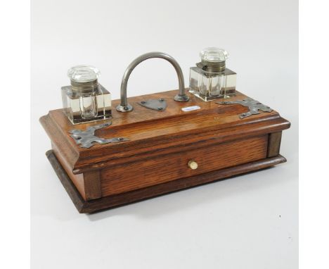 An early 20th century light oak desk stand, 29cm
